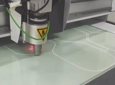 Precision cutting of paddle face materials on the factory floor