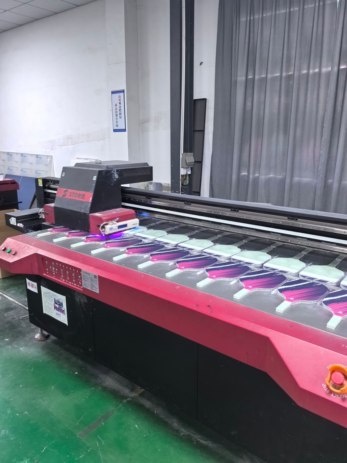 UV printing machine printing custom designs on paddles